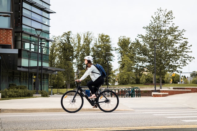 Rider on an electric bicycle on a paved road
